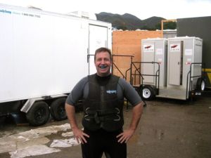 Arms Akimbo... by porta potties.